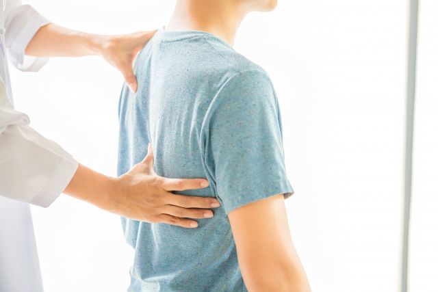 Close up of physiotherapist working with patient in clinic1